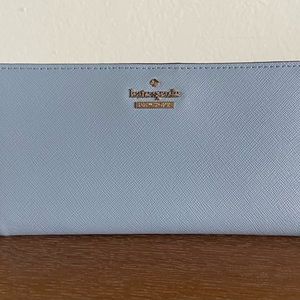 Kate Spade slim bifold wallet in a pretty light blue.
